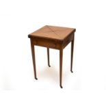 An Edwardian mahogany envelope card table