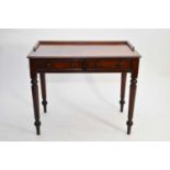 A Victorian mahogany writing table