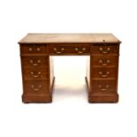 A 20th century mahogany pedestal desk