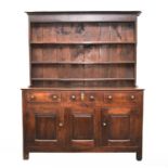 An 18th century oak dresser and rack