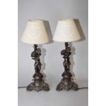 A pair of bronze figural table lamps