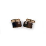 A pair of yellow metal diamond set cufflinks