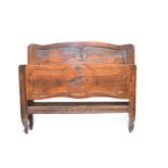 A French Louis XV style mahogany bedstead