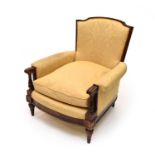 A 19th century upholstered armchair and an Edwardian armchair