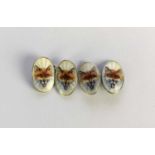 A pair of white metal and enamel cufflinks