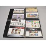 Four albums of Royal Mint presentation packs