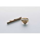 A 9ct gold signet ring and tie slide