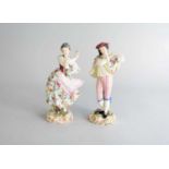 A pair of German porcelain figures decorated by Richard Klemm (1869-1915)