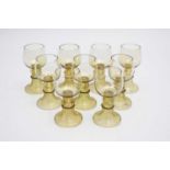 A set of nine of German roemers, circa 1880of typical form, green glass with strawberry prunts to