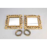 A pair of giltwood wall mirrors and a pair of small oval frames