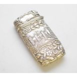 An embossed white metal cigar case