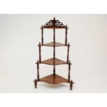 A Victorian walnut four-tier corner whatnot