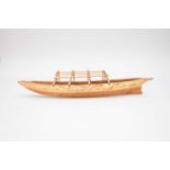 A large South Pacific Samoan model war canoe with paddles