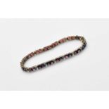 A 9ct gold garnet and diamond bracelet