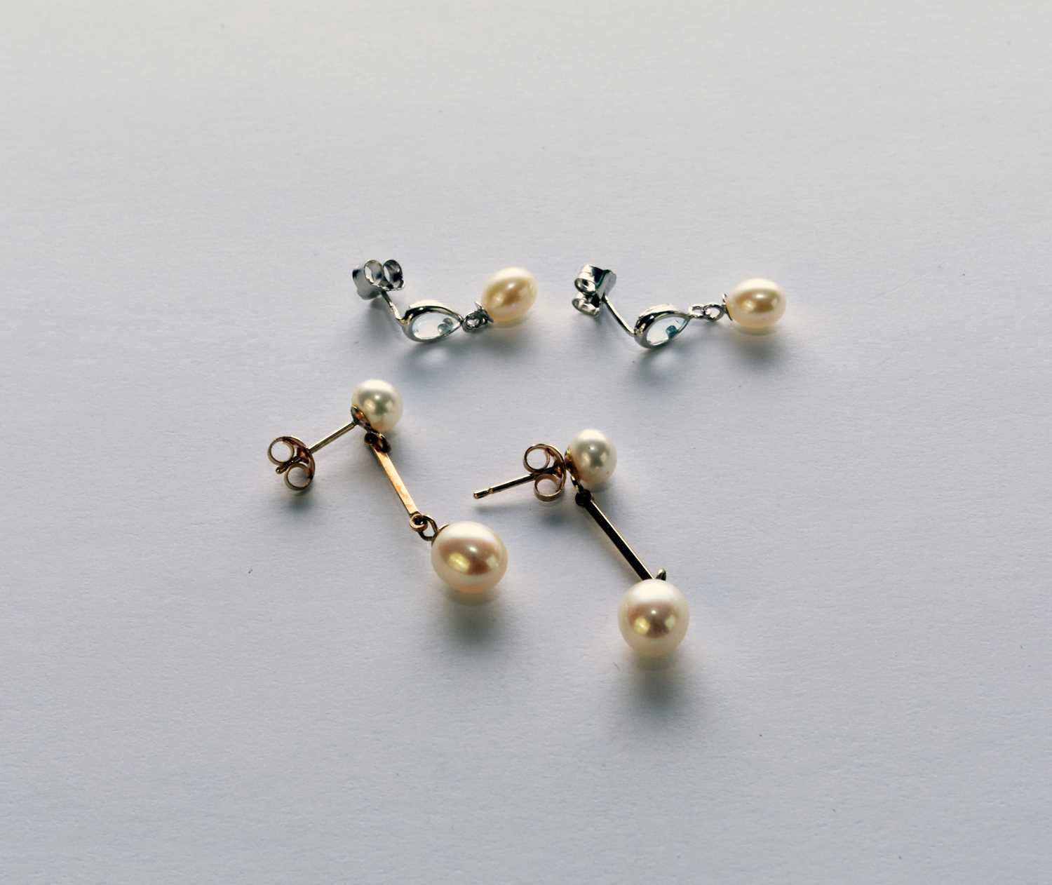 Two pairs of cultured pearl earrings