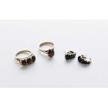 Two garnet set rings and a pair of earrings