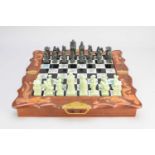 A Chinese carved wood and hardstone chess compendium