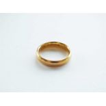 A 22ct gold plain polished wedding band