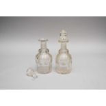 A pair of 19th century engraved decanters, one stopper broken, section detached (5)