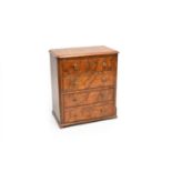 A Victorian figured walnut miniature chest of 4 long drawers