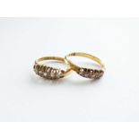 Two 18ct gold five stone graduated diamond rings