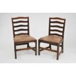 A pair of fruitwood ladder back standard chairs