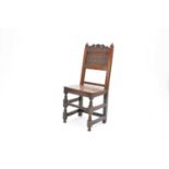 A 17th century oak standard chair
