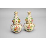 A pair of Meissen floral-encrusted double gourd vases