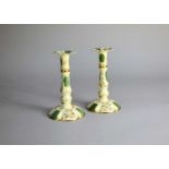 A pair of Halycon Days enamel candlesticks