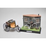 A scale model Harley Davidson and Benz Motorwagen