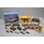 A collection of various boxed and unboxed die-cast vehicles