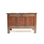 An 18th century carved oak coffer