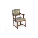 A late Victorian oak upholstered open armchair