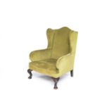 A 19th century upholstered wing armchair