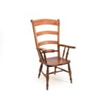 An ash and yew wood ladder-back kitchen chair