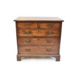 A George III mahogany chest of two short over three long drawers