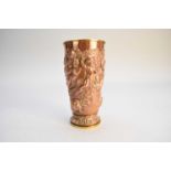 A 19th century French embossed copper and brass beaker cup