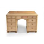 A 20th century pine pedestal desk