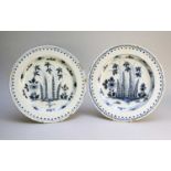 A pair of English delft blue and white chargers, 18th century