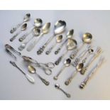 A collection of silver and white metal flatware