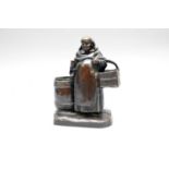 A Continental bronze figural monk taper and match holder