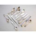 A collection of silver and white metal cutlery