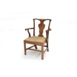 A George III walnut elbow chair