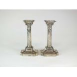 A pair of Victorian silver Corinthian column candlesticks