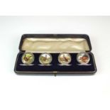 An Edwardian cased set of four silver and enamel menu holders by Sampson Mordan & Co Ltd