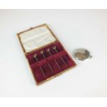 A cased set of four silver gilt cocktail sticks and a silver vesta case