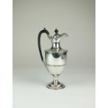 An Edwardian silver hot water jug