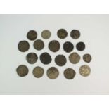 A collection of nineteen English and Foreign hammered silver pennies and half pennies