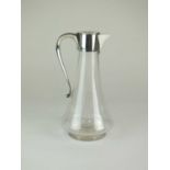 An Edwardian silver mounted glass claret jug