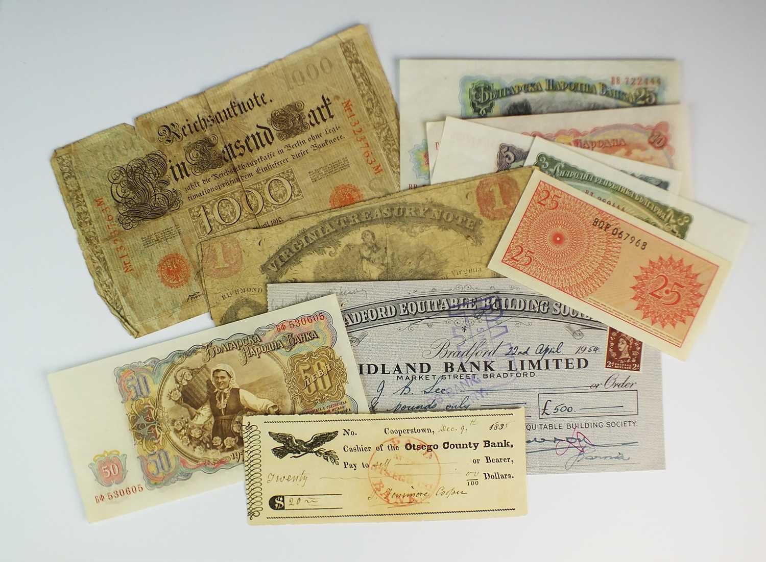 A small collection of banknotes and cheques